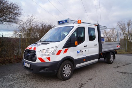 Umbau Pritsche - Mainfranken Netze Würzburg, Ort/Kunde: Mainfranken Netze GmbH, Fahrzeug: Ford Transit, Typ: Pritschenaufbau - HENSEL Fahrzeugbau - Auslieferung Kundenfahrzeug